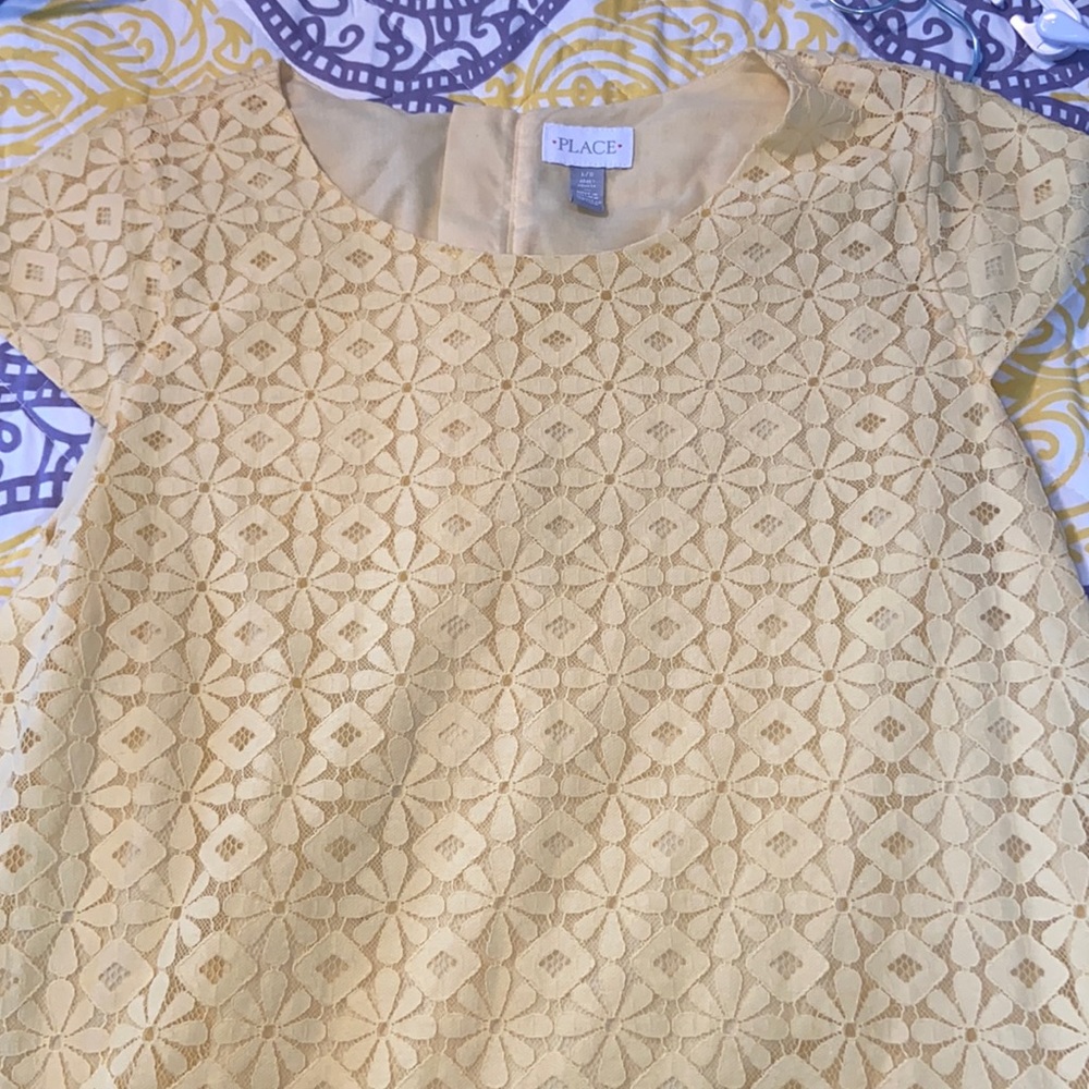Adult dress like new. Zipper in back, yellow, lace detail inner shell lining.